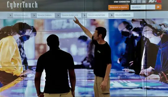 Interactive Touch Screen with Go Media Team giving tutorial